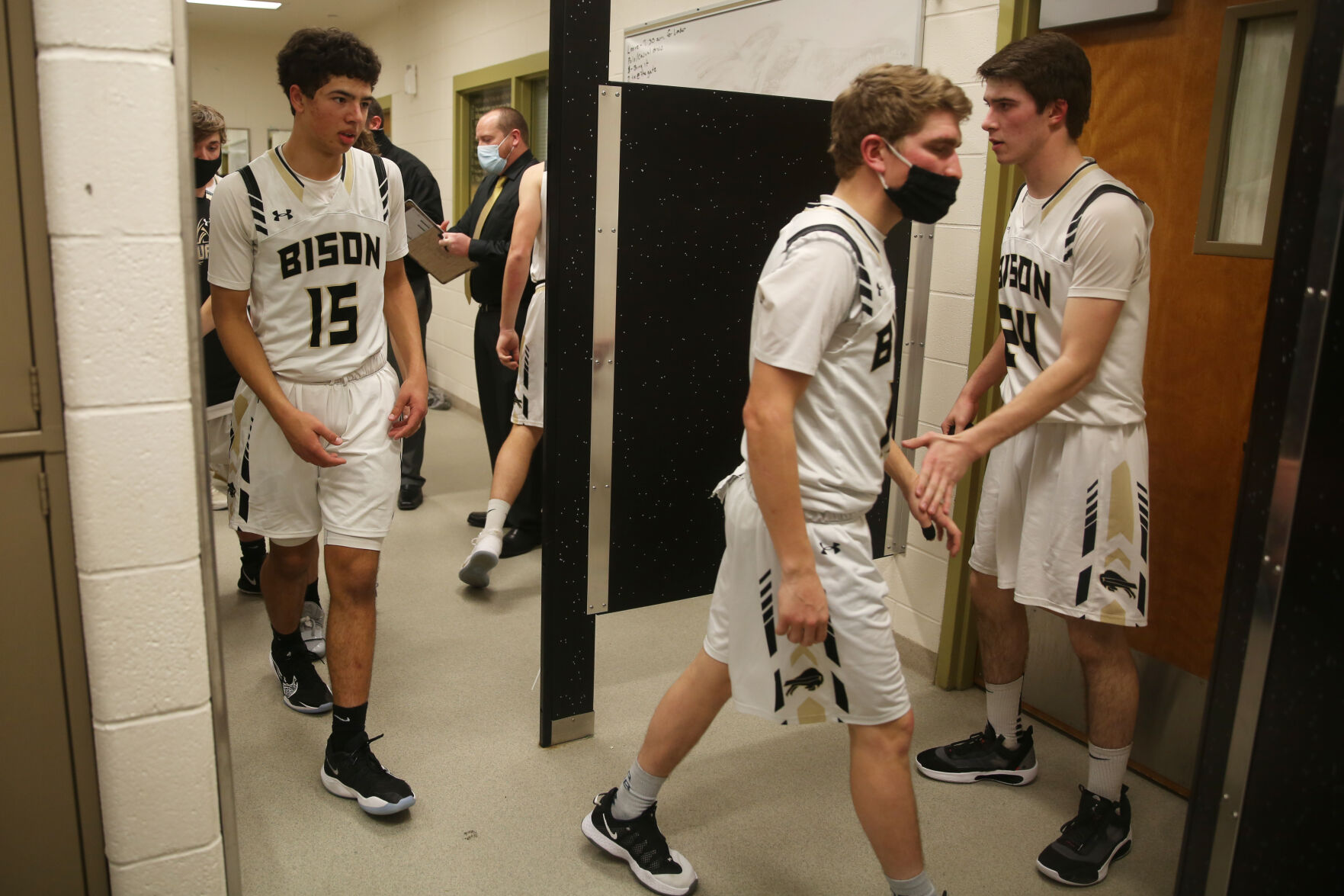 Colby Bessler high fives each of his teammates